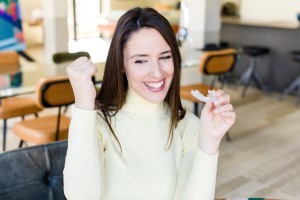 woman holding invisalign tray